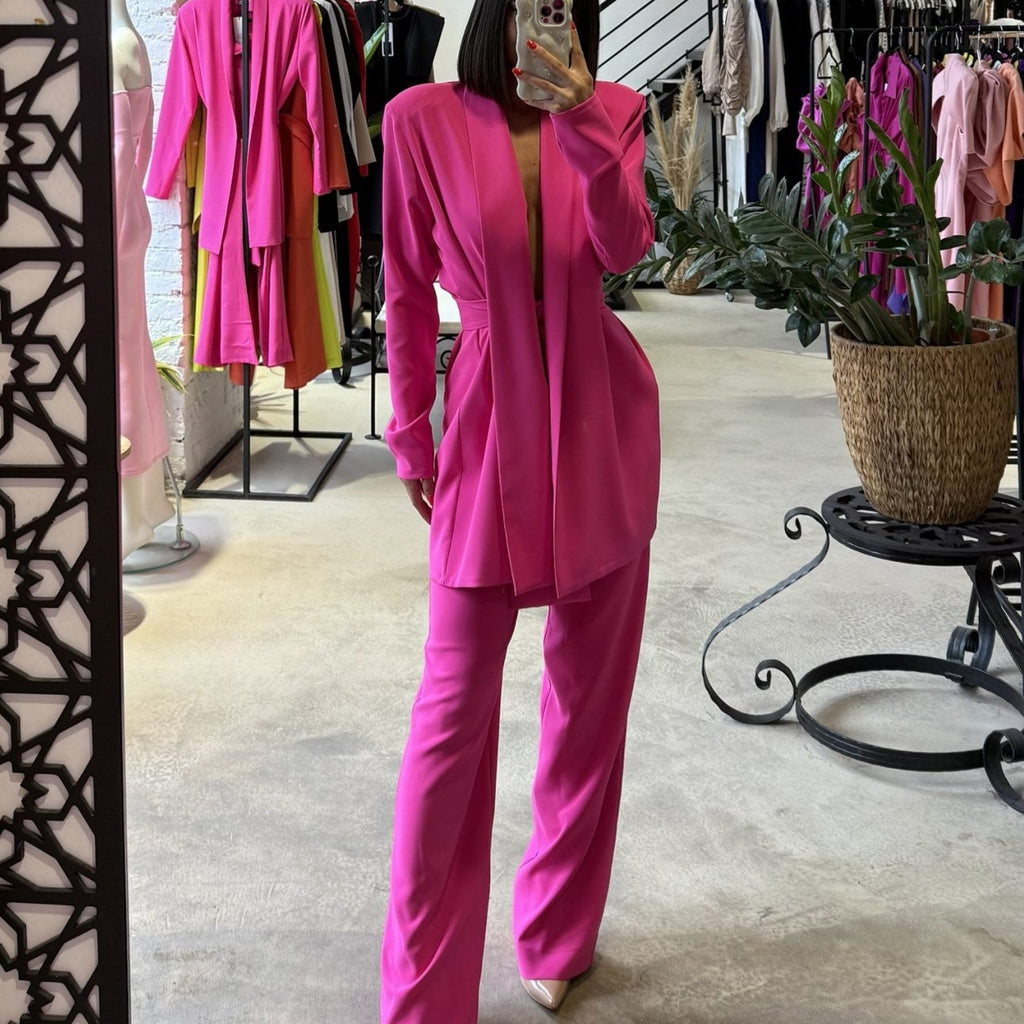 pink pantsuit in boutique mirror view pink pantsuit in boutique mirror view
