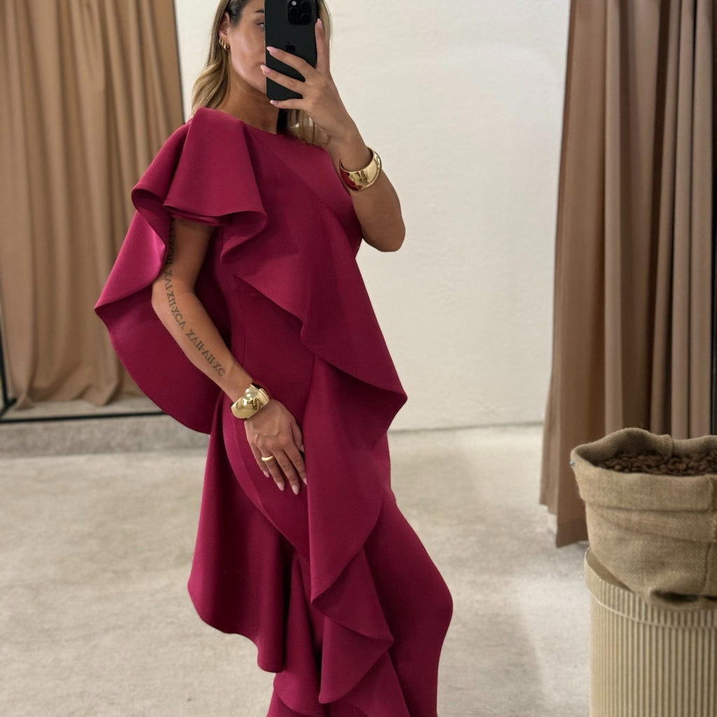 woman wearing elegant magenta dress with ruffles woman wearing elegant magenta dress with ruffles