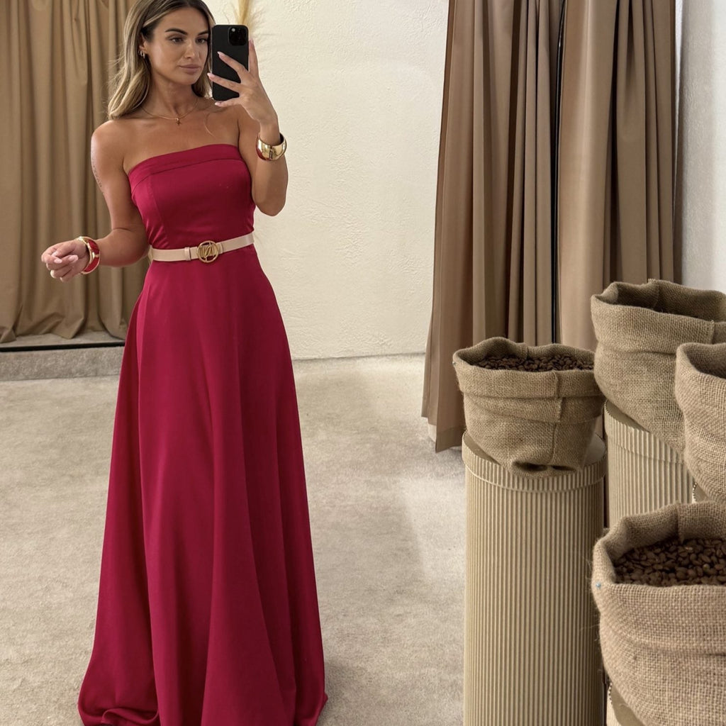 woman wearing pink strapless dress in changing room woman wearing pink strapless dress in changing room