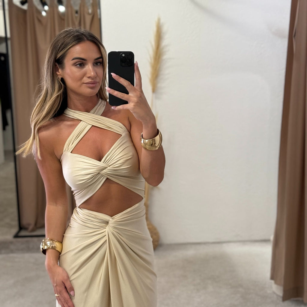 woman wearing elegant cutout dress in fitting room woman wearing elegant cutout dress in fitting room