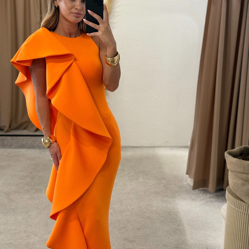 orange ruffled dress in fitting room orange ruffled dress in fitting room