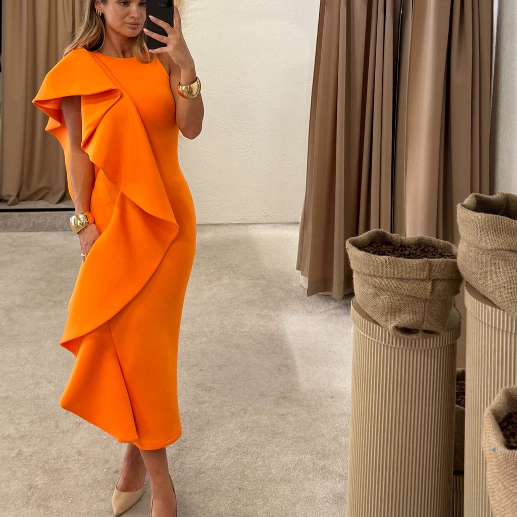 woman wearing orange ruffled midi dress woman wearing orange ruffled midi dress
