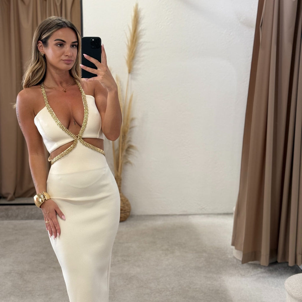 woman in white embellished dress fitsnug in fitting room woman in white embellished dress fitsnug in fitting room