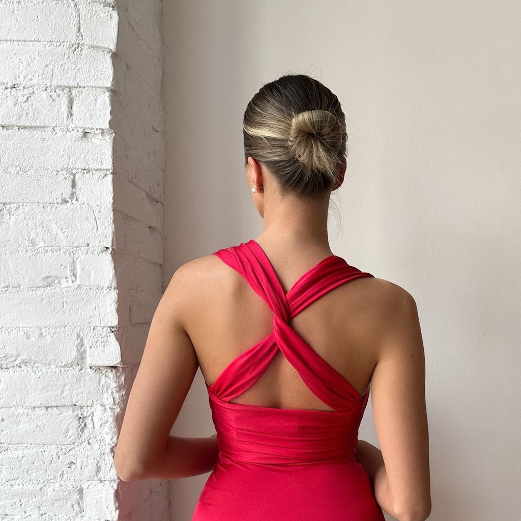 back view of woman in red crossback dress back view of woman in red crossback dress