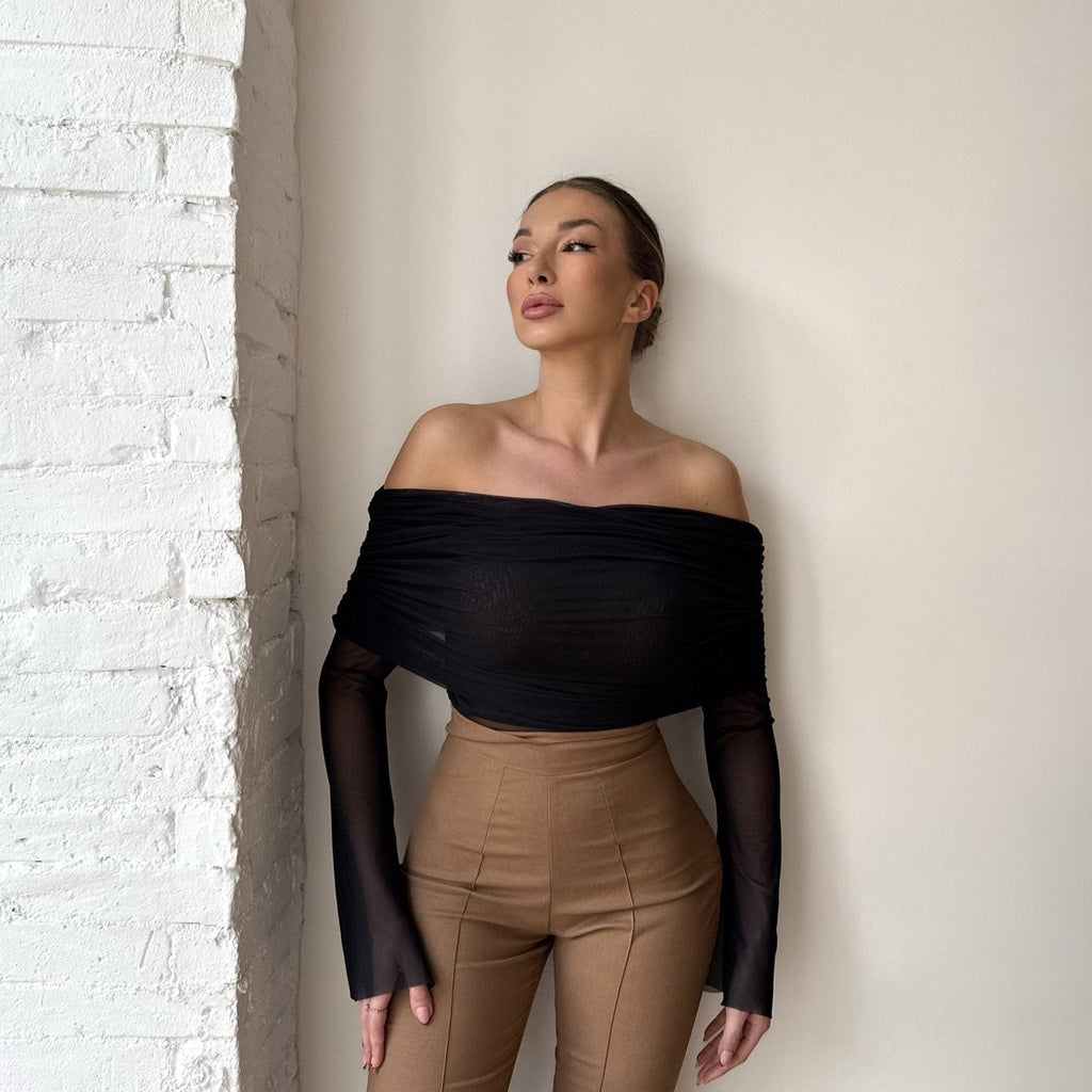 off shoulder black top with tan pants off shoulder black top with tan pants
