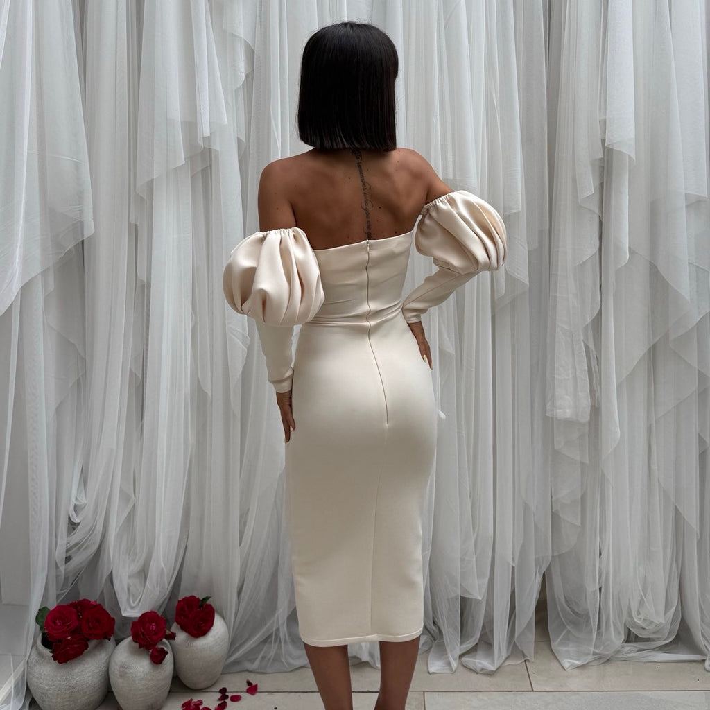 woman in off shoulder beige dress back view woman in off shoulder beige dress back view