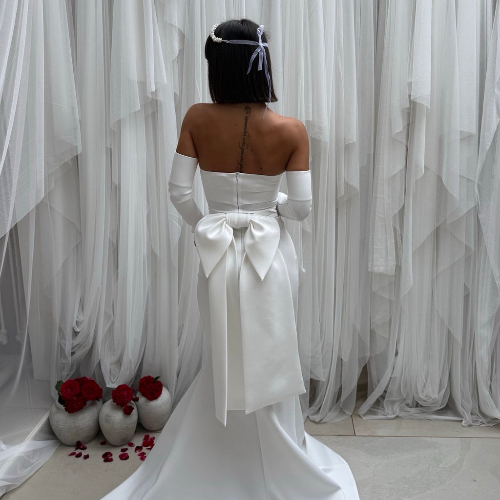 elegant off shoulder white gown with bow and train elegant off shoulder white gown with bow and train