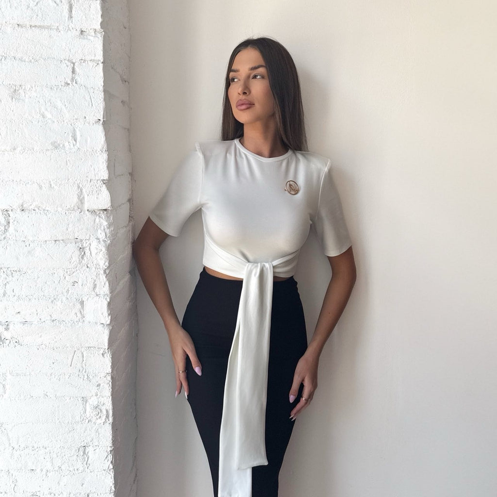 woman in stylish white top and black skirt woman in stylish white top and black skirt