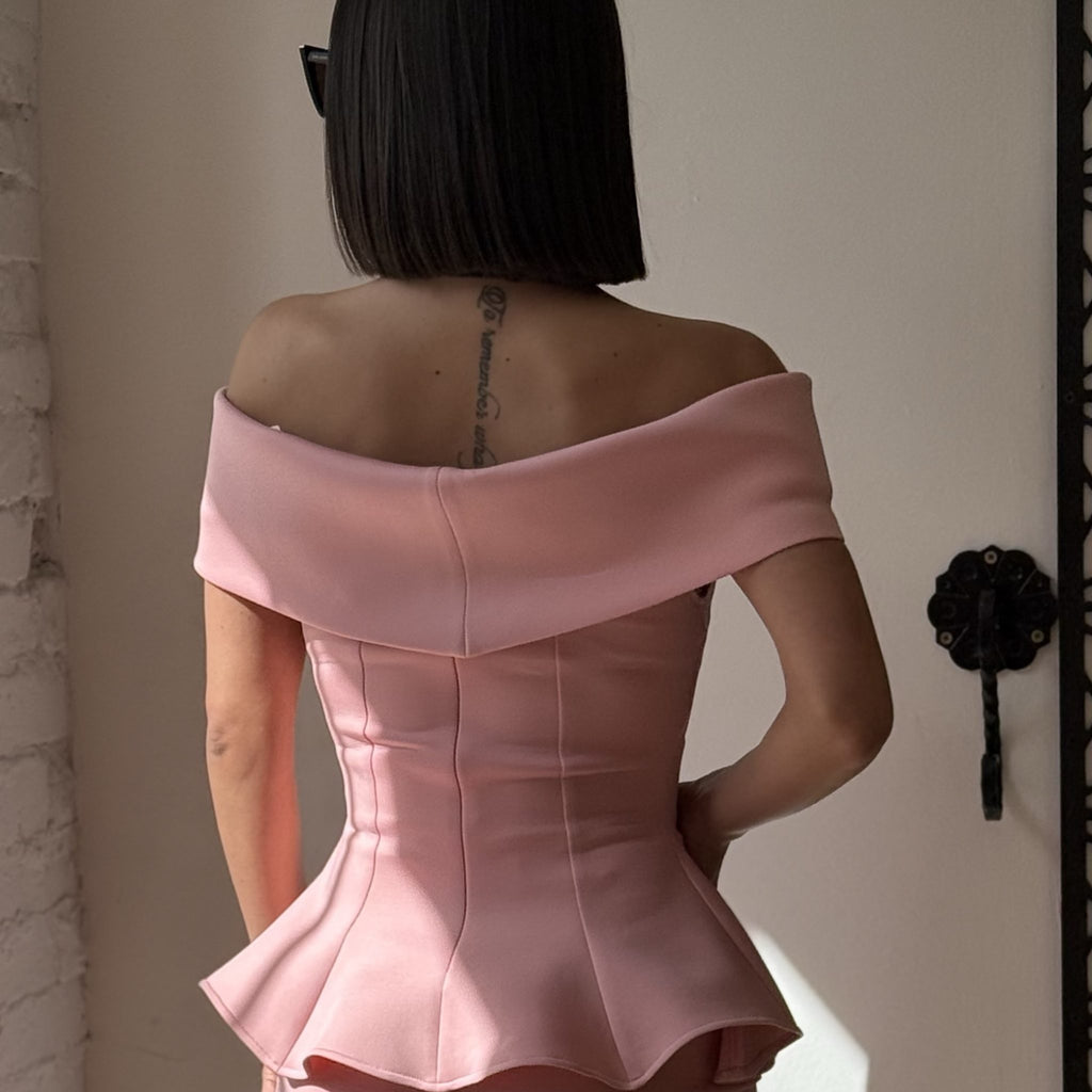 back view of woman in pink off shoulder dress back view of woman in pink off shoulder dress
