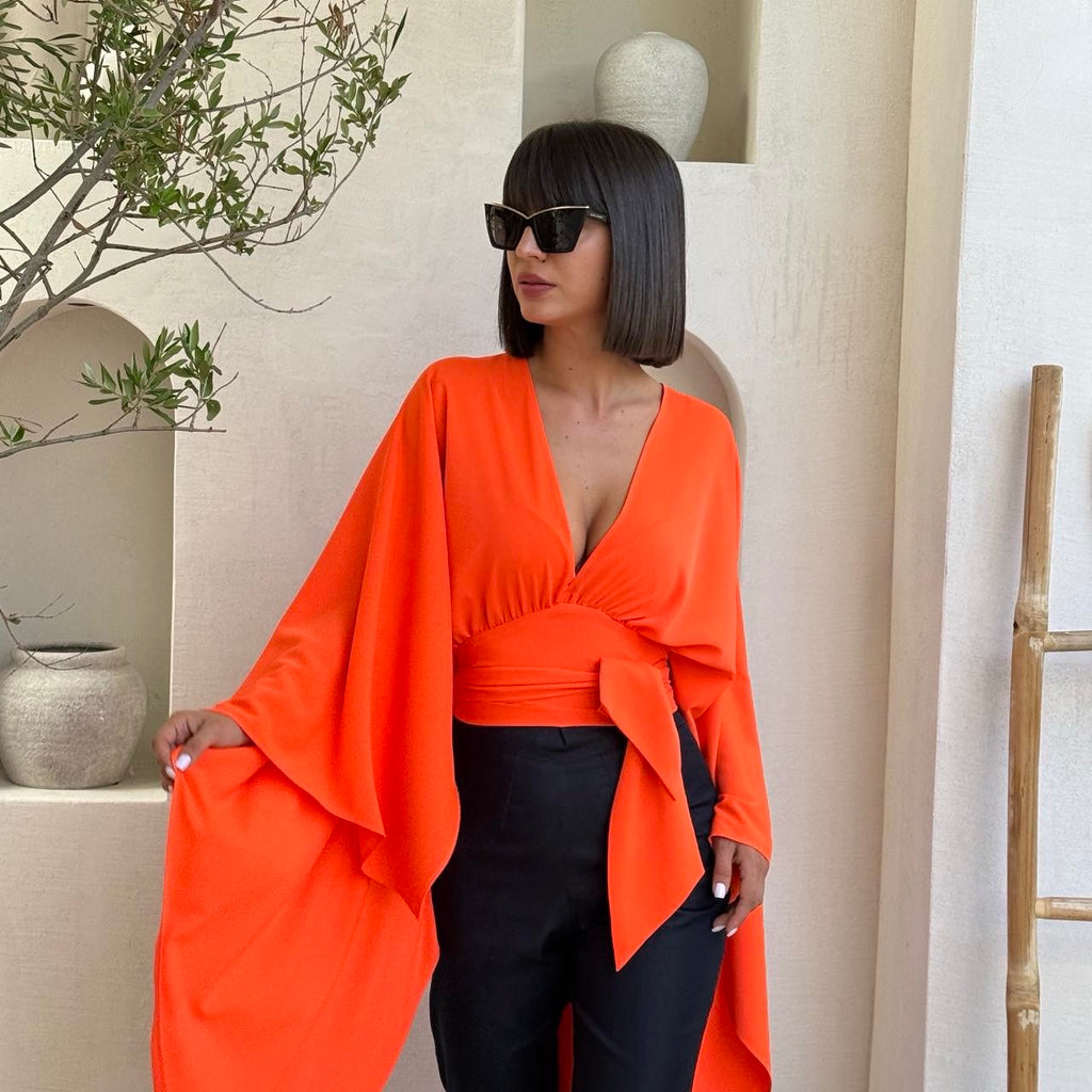 bright orange flowy top with black pants bright orange flowy top with black pants