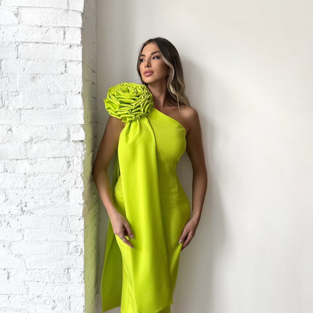 woman in neon yellow one shoulder midi dress with floral detail woman in neon yellow one shoulder midi dress with floral detail