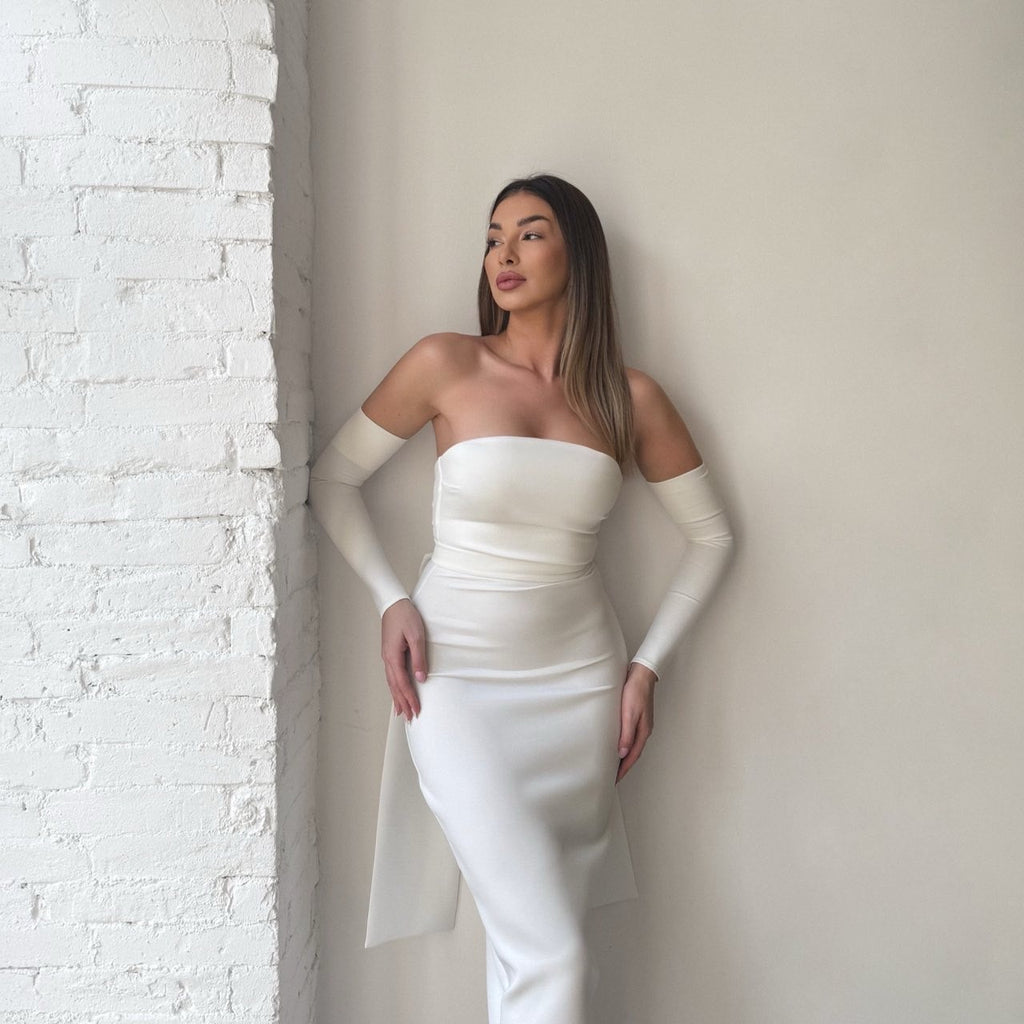 woman in elegant white off the shoulder dress woman in elegant white off the shoulder dress
