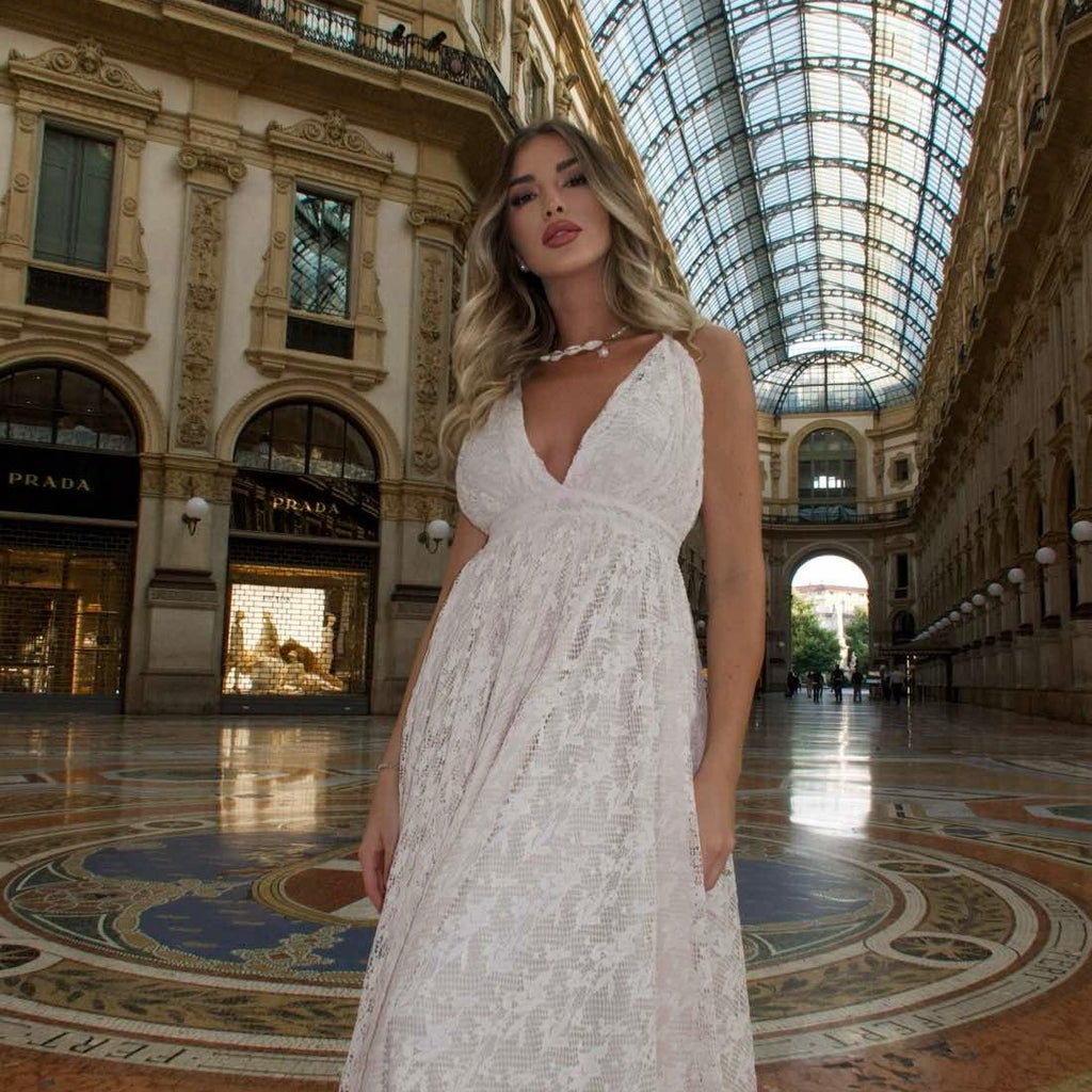woman in elegant white lace dress in galleria vittorio emanuele milan woman in elegant white lace dress in galleria vittorio emanuele milan