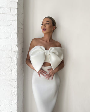 white dress with large bow design