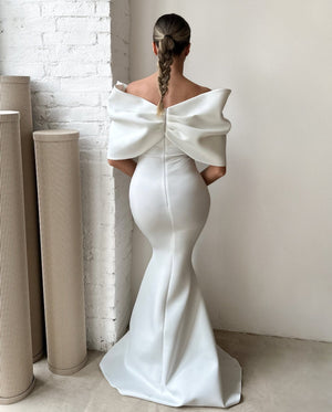 woman wearing elegant white off the shoulder gown