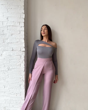 woman in grey top and pink pants