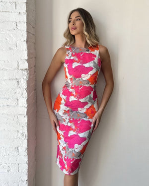 woman wearing pink orange abstract print dress