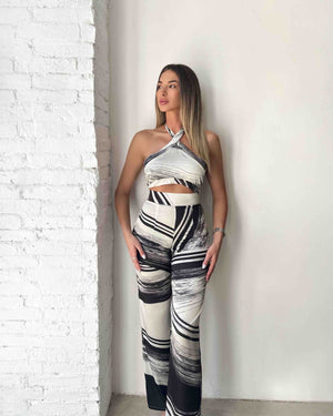 model wearing black and white printed outfit