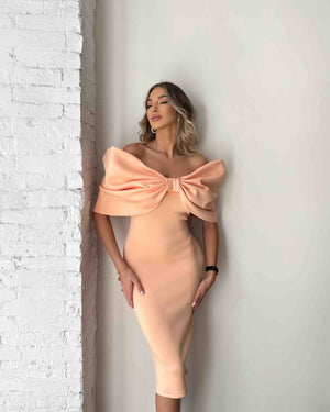 peach off shoulder dress with large bow