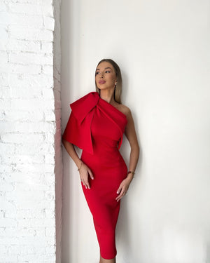 woman wearing red off shoulder dress with bow detail