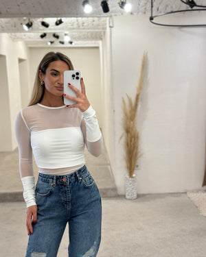 white mesh long sleeve top and ripped jeans