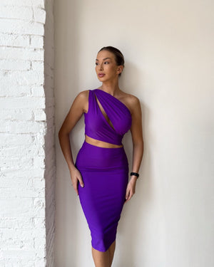 woman wearing purple one shoulder cutout dress