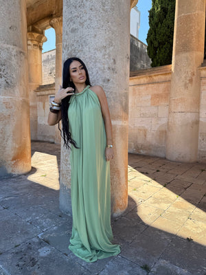 green maxi dress in ancient ruins setting