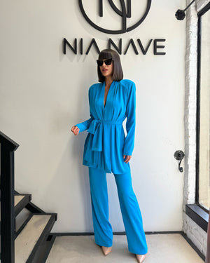 blue belted pant suit and sunglasses