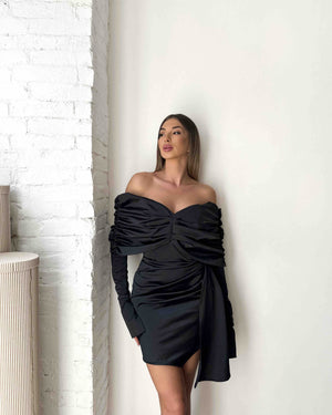 woman in off shoulder black mini dress