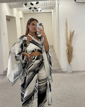 black and white abstract print dress set in modern boutique setting