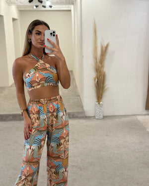 model wearing printed top and pants set in mirror selfie
