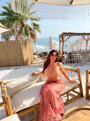 boho beach outfit with pink maxi skirt