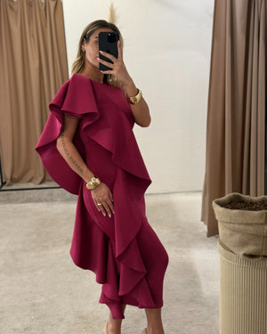 woman wearing elegant magenta dress with ruffles