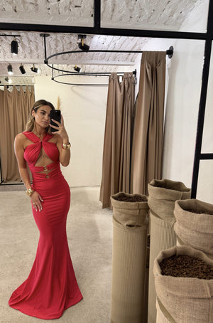 woman in red halter neck evening dress in fitting room