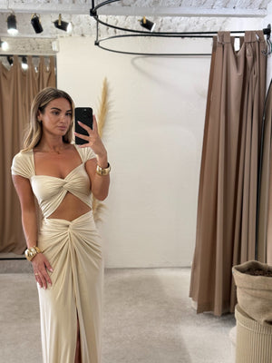beige cutout maxi dress in fitting room