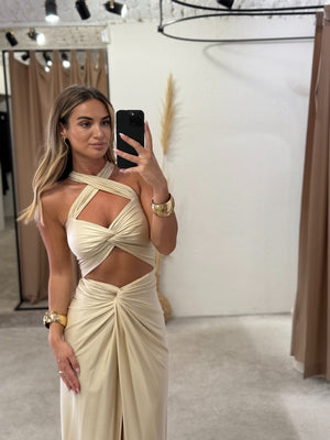 woman wearing elegant cutout dress in fitting room