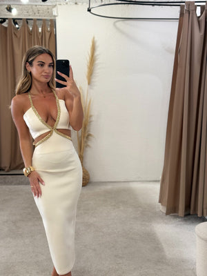 woman in white embellished dress fitsnug in fitting room