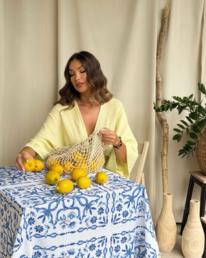 woman in yellow dress with lemons