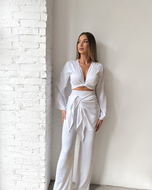 white long sleeve wrap top and pants outfit