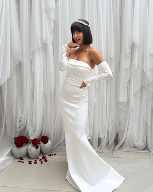elegant white off shoulder gown with headpiece