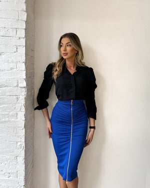 woman wearing black blouse and blue pencil skirt