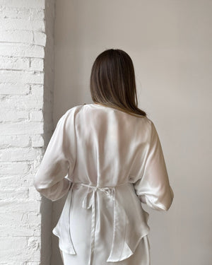woman wearing white satin dress back view