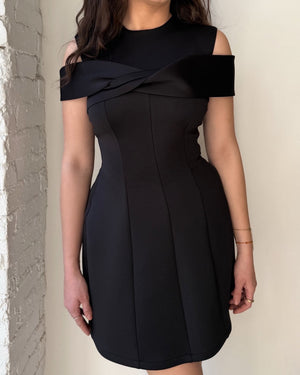 woman wearing elegant black off shoulder dress