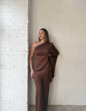 model wearing brown one shoulder dress
