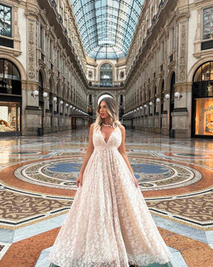 woman in elegant lace gown in luxurious gallery