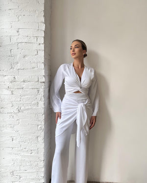 model in stylish white two piece outfit
