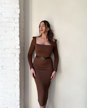 brunette woman wearing brown long sleeve dress
